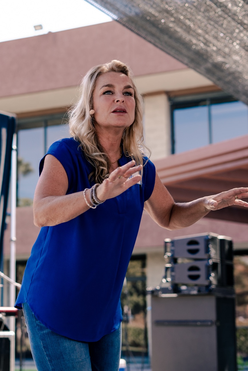 Megan speaking at an outdoor event